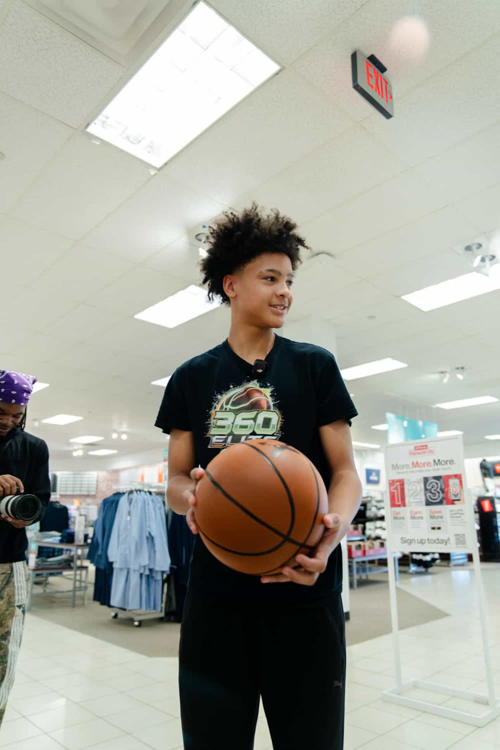 Customer holding the YGA Silent Basketball at a store