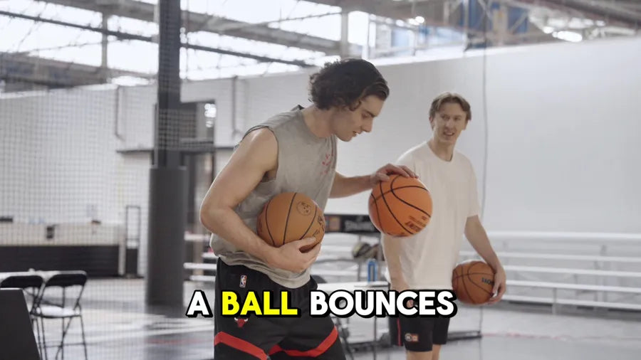 Josh Giddey comparing a regular basketball with the YGA Silent Basketball in the gym