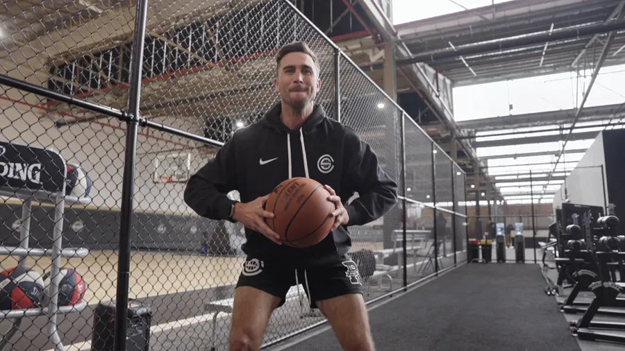 Jordan Lawley gripping the YGA Silent Basketball in the training gym