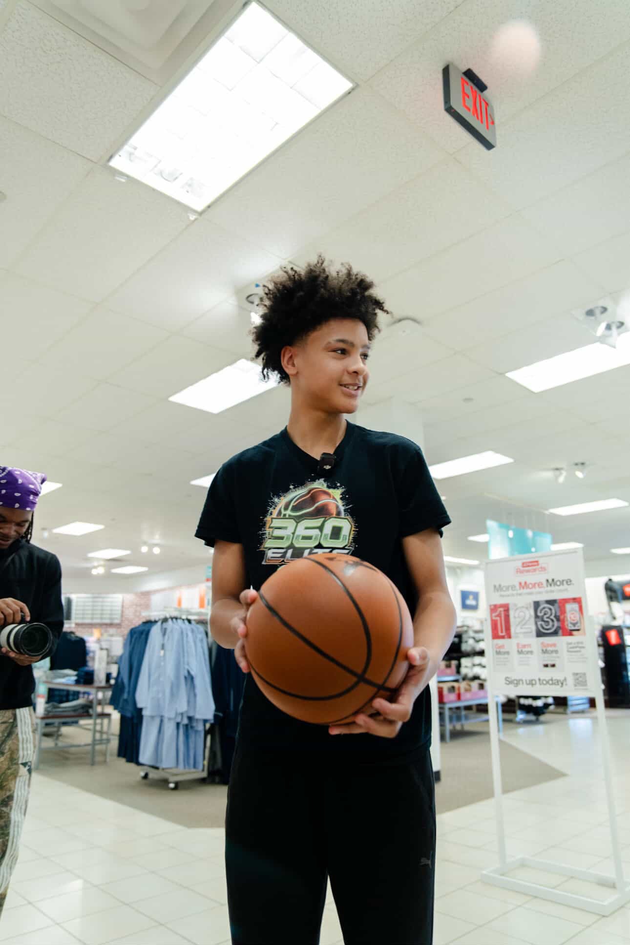 Customer holding the YGA Silent Basketball at a store