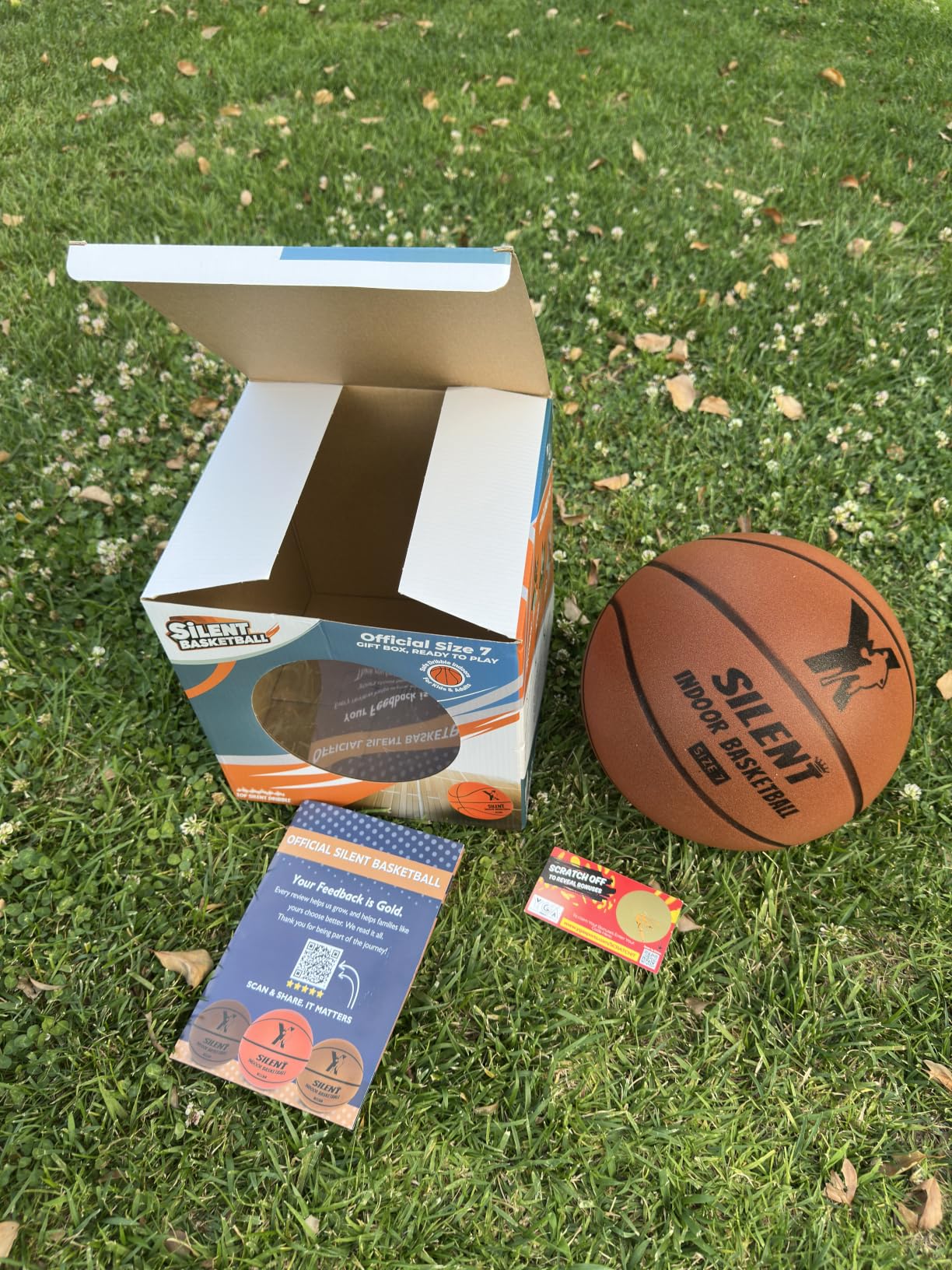 Silent Basketball gift box unboxed on grass