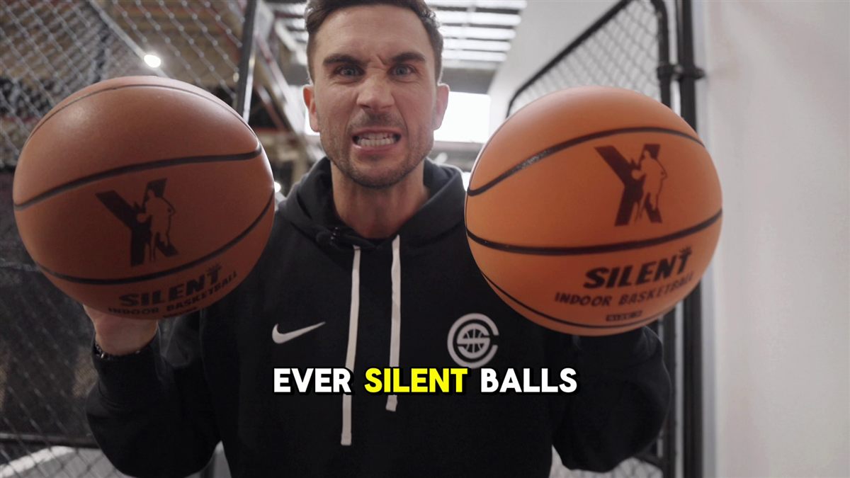 Jordan holding two YGA Silent Basketballs